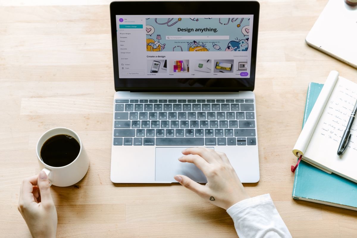 Designer working on a website layout on a laptop